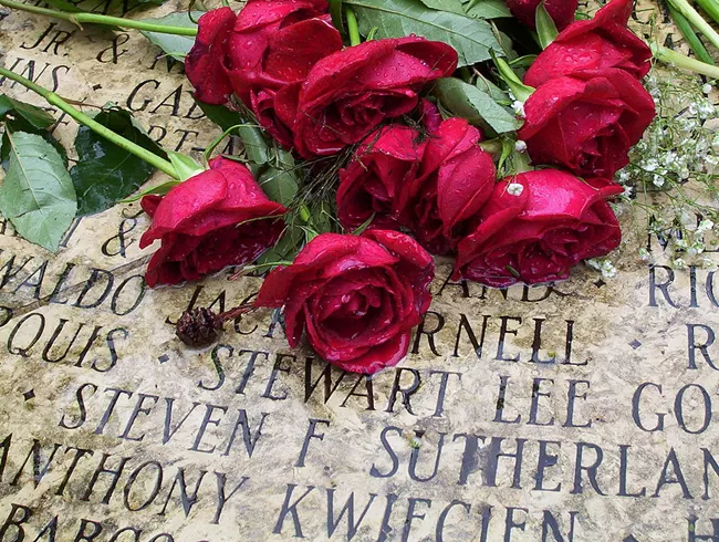 Roses lie atop names at the National AIDS Memorial Grove, Golden Gate Park, San Francisco, CA. 